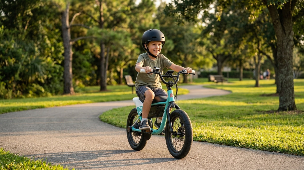 Kid wearing a helmet riding a kids electric bike on a sunny suburban park path