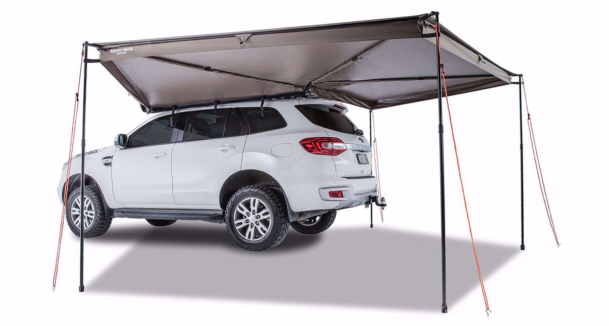 Rhino-Rack 33100 Batwing 270-Degree Awning deployed on a vehicle, driver's side view