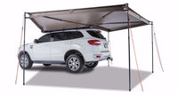 Rhino-Rack 33100 Batwing 270-Degree Awning deployed on a vehicle, driver's side view