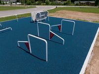 Children playing on the ActionFit Challenge Zone outdoor fitness structure at an elementary school