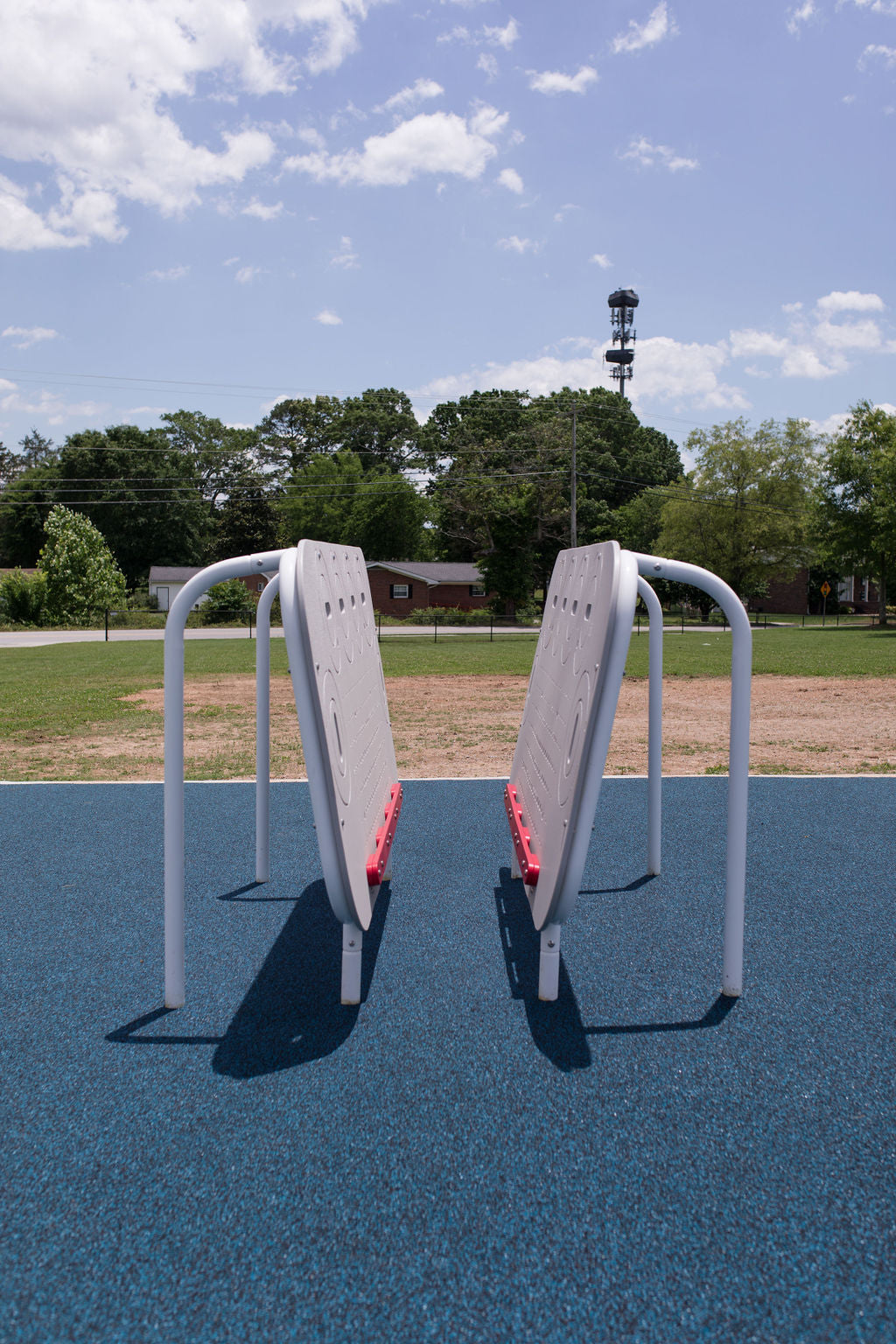 Child using the ActionFit Hero Zone wall-walking fitness station outdoors