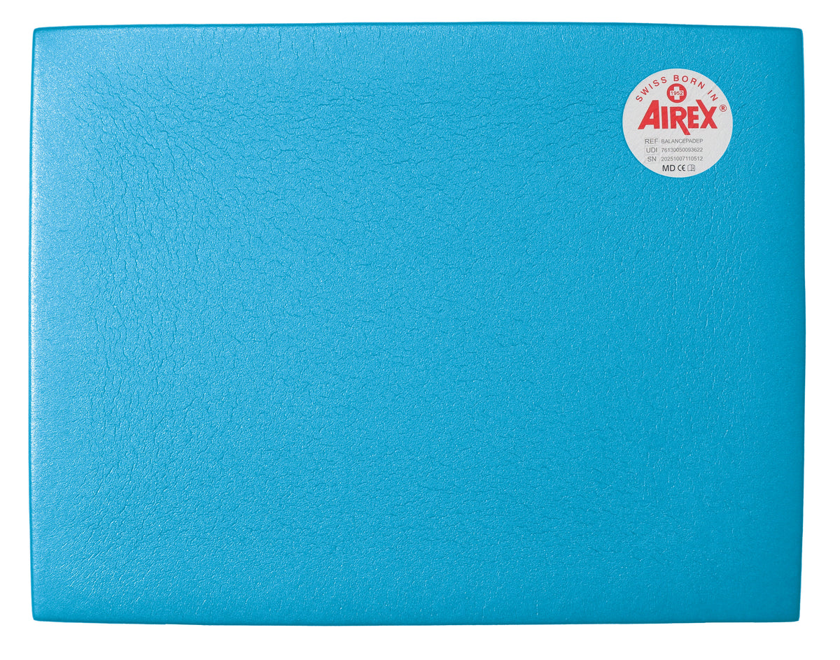 Airex Balance Pad Standard Blue angled view showing smooth surface and foam thickness