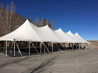 Ohenry 30' x 110' high peak pole tent set up as a party tent for a large outdoor event