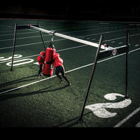 Rogers Athletic Open Field Tackle Machine - main hero view with hanging dummy
