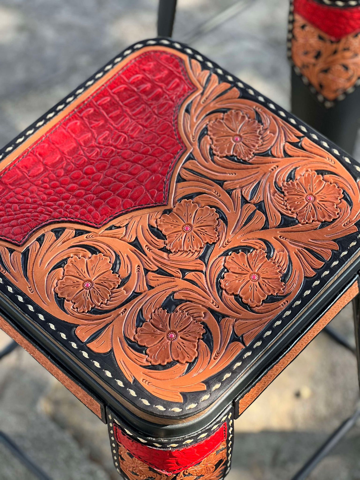 Alamo Saddlery Bar Stools with Red Gator leather inlay, golden leather with full floral hand tooling and black background paint