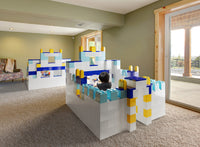 Children and adults building a large walk-in fort with EverBlock modular building blocks