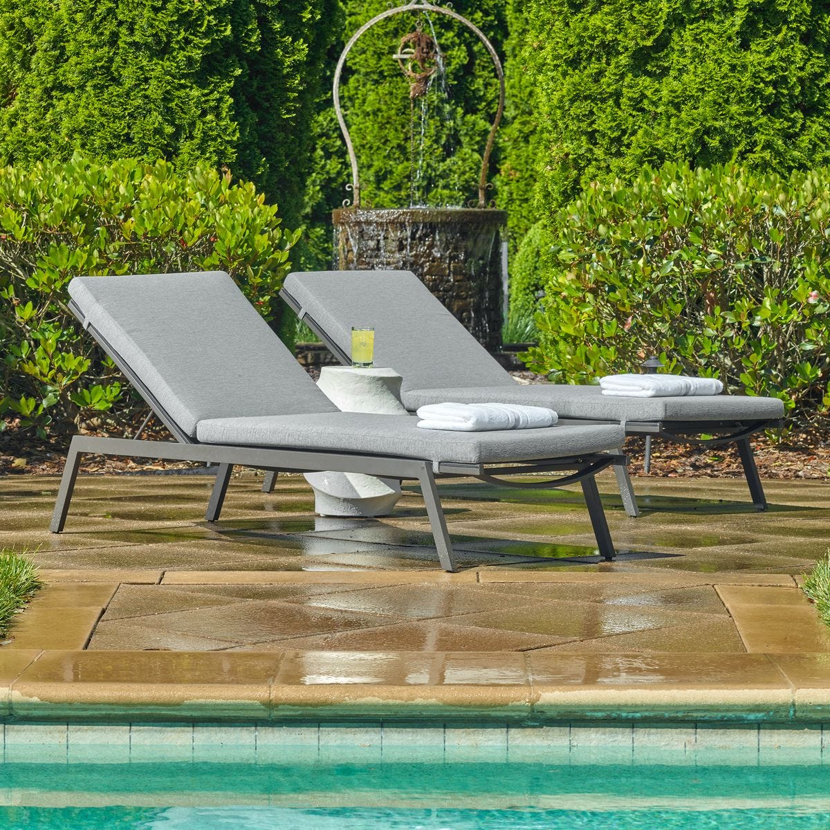 Uttermost Bea Outdoor Pool Chaise Lounge with charcoal gray cushion and java black aluminum frame