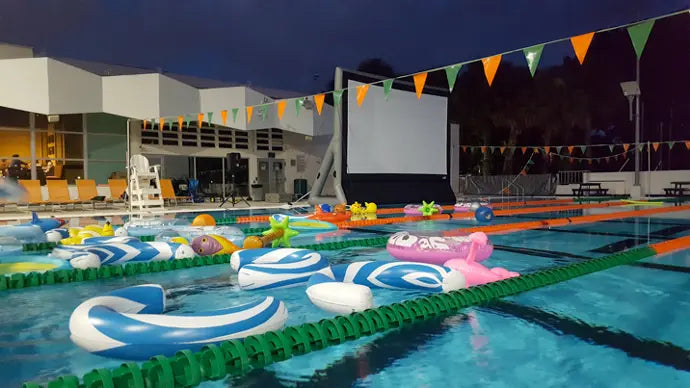 Epic Outdoor Cinema Pro 16 Complete Outdoor Movie System with inflatable screen, projector, and speaker setup