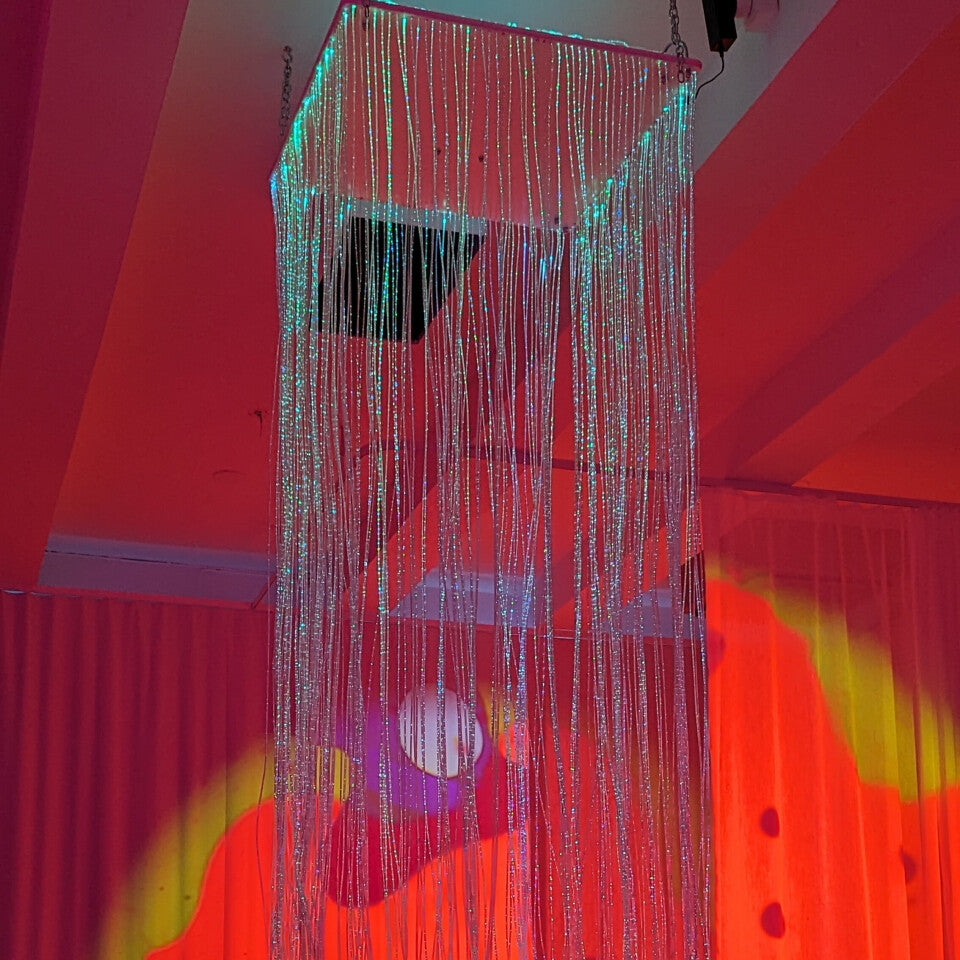 Fiber Optic Waterfall cascading 200 fiber optic strands through a 24-inch mirrored platform