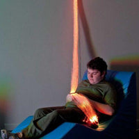 Fiber Optic Wall Sconce with Tails - glowing color-changing fiber optic strands cascading from mirrored sconce