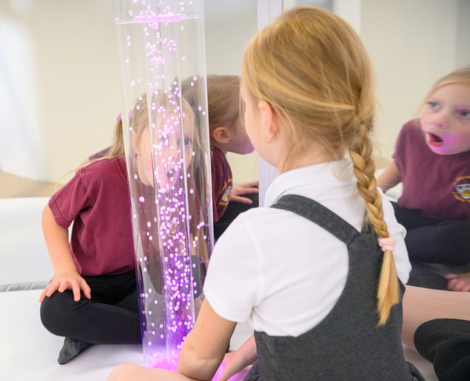 Interactive Hurricane Tube full view showing LED-lit white beads in motion