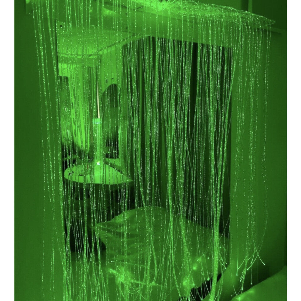 Fiber Optic Curtain Wall Mount showing 200 glowing fiber optic tails in clear acrylic bracket