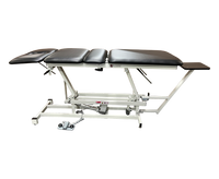 Armedica AM-400 Four-Section Traction Table with adjustable lumbar section and foot control pedal