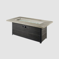 Cedar Ridge Linear Gas Fire Pit Table with fire glass gems and active flame on grey background