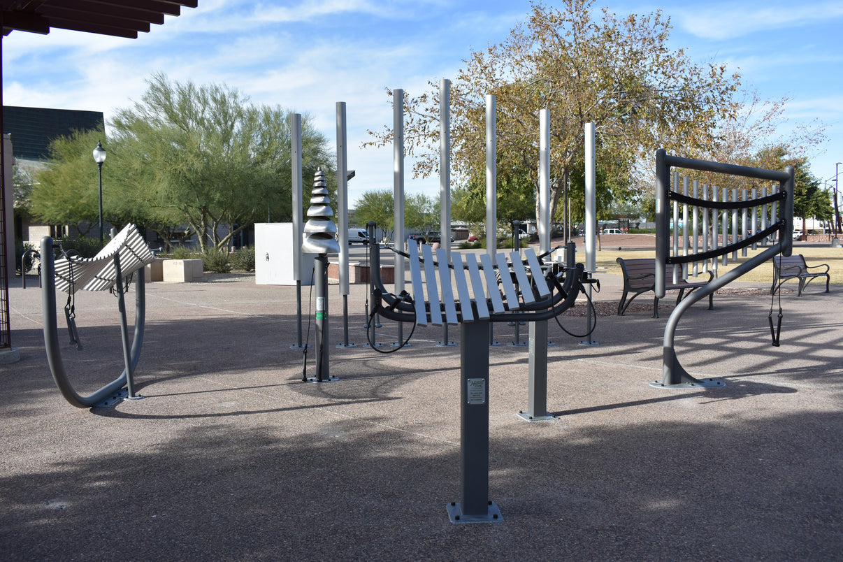 Freenotes Sculptural Ensemble installed outdoors showing full grouping of musical instruments with steel posts