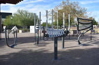 Freenotes Sculptural Ensemble installed outdoors showing full grouping of musical instruments with steel posts