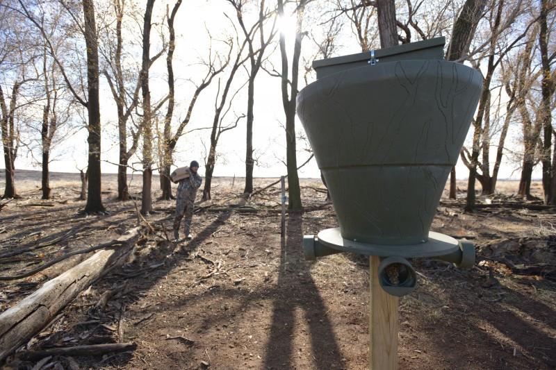 Banks Outdoors FeedBank 600 Gravity Deer Feeder mounted on post - full view