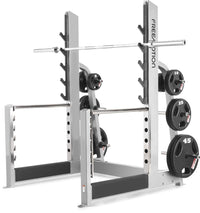 Freemotion Olympic Squat Rack EF212 three-quarter view with bar and weight plates loaded