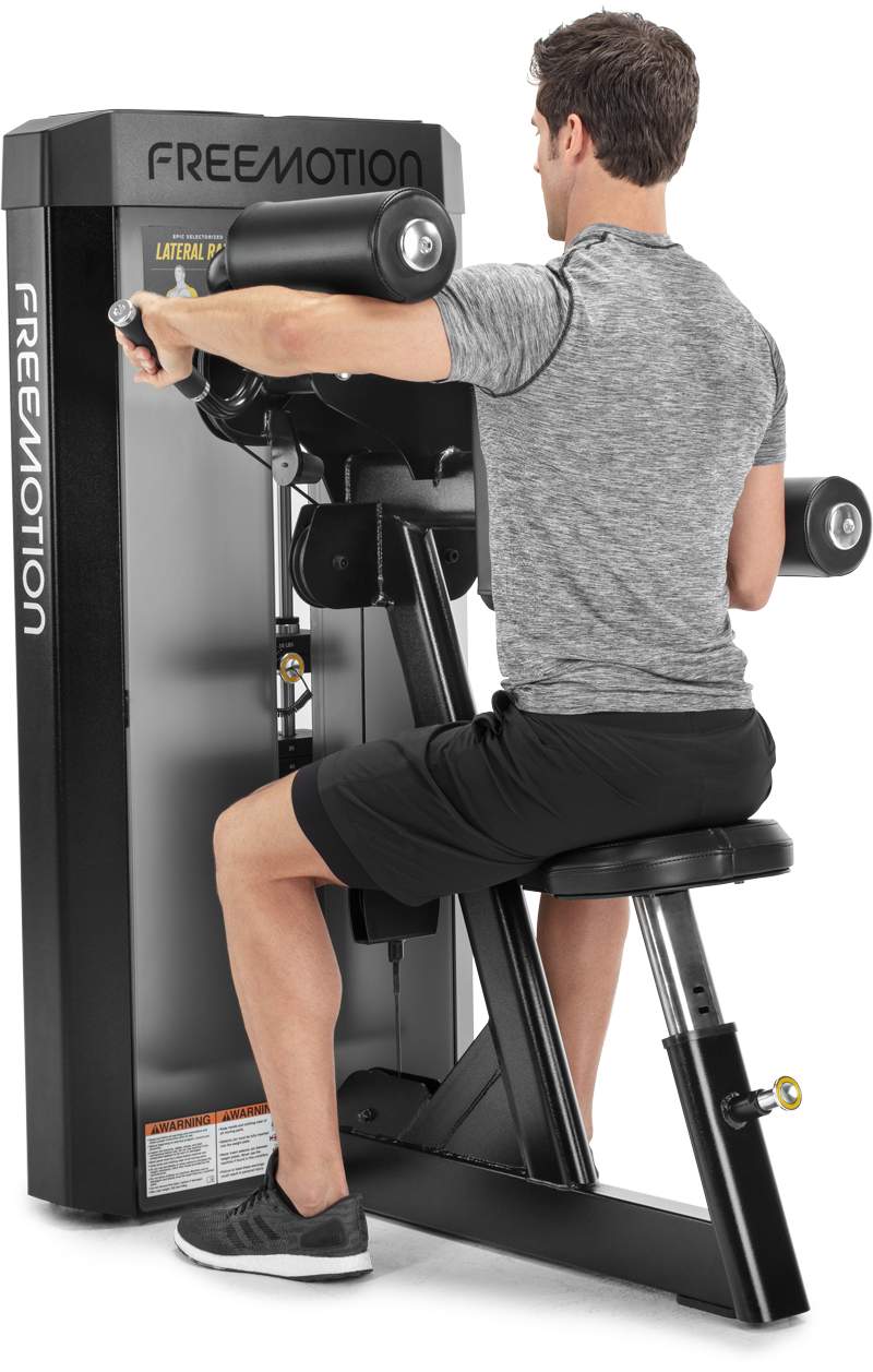 Freemotion EPIC Selectorized Lateral Raise machine - 3/4 view with male user