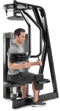 Freemotion EPIC Selectorized Torso Rotation machine - three-quarter view with male user