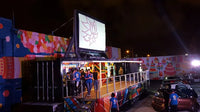 EcoCine Pro 12 Outdoor Cinema System with inflatable screen, laser projector, and battery-powered speakers