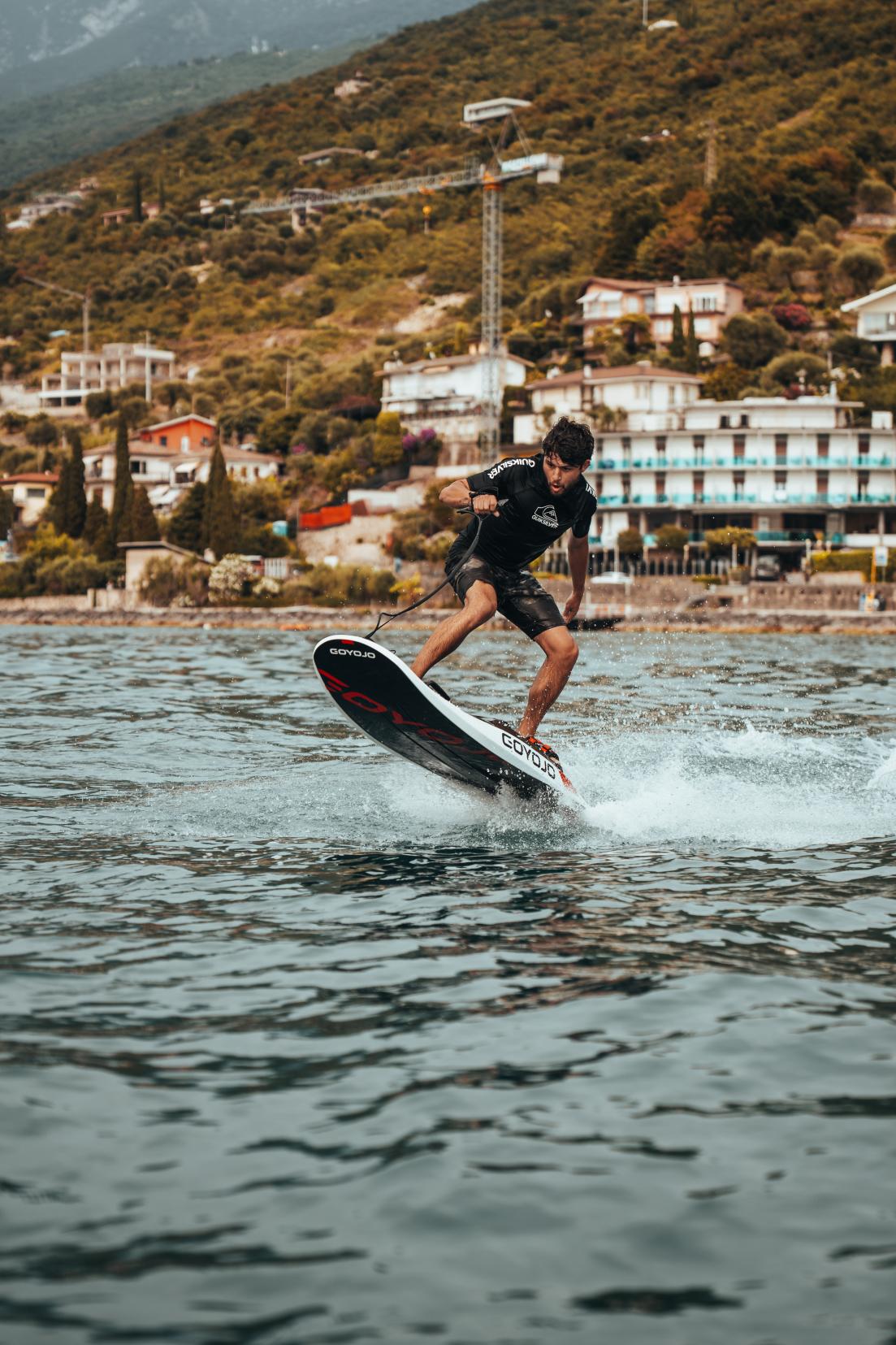 Goyojo Volans Air eFoil Board hero shot - inflatable electric hydrofoil on water
