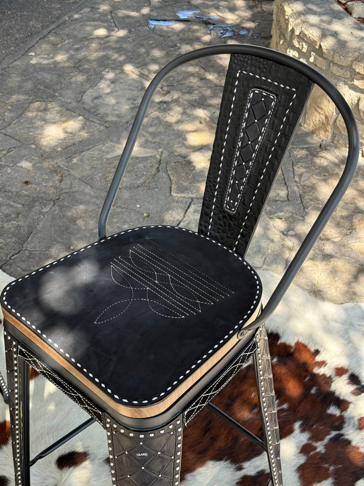 Alamo Saddlery Black Cowboy Stitch Swivel Bar Stools with Tall Back - hero view