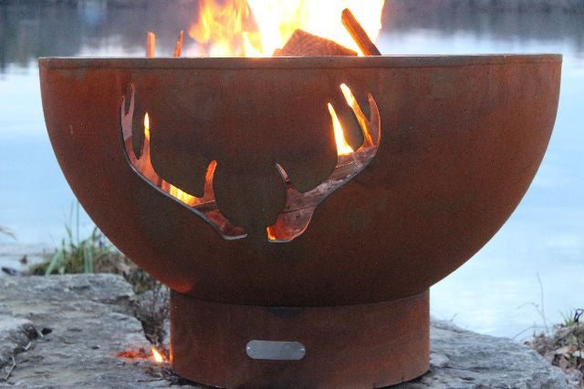 Fire Pit Art Antlers Fire Pit lit at night showing antler silhouette design