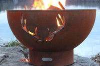 Fire Pit Art Antlers Fire Pit lit at night showing antler silhouette design
