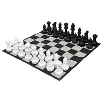 25 inch Giant Chess Set with all 32 pieces and nylon board laid out outdoors