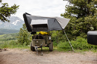 Smittybilt Overland XL Hard Shell Rooftop Tent mounted on vehicle - front view