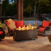 Outdoor Greatroom Balsam Montego Linear Gas Fire Pit Table on a scenic patio with flowers