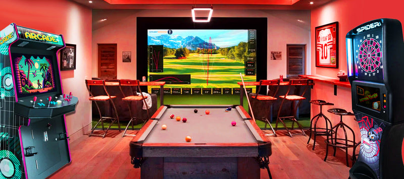 Custom golf simulator room with pool table, arcade machine, and bar area in a luxury game room