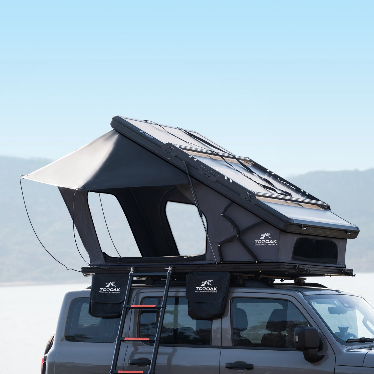 TOPOAK Nebula hard shell rooftop tent mounted on vehicle - hero shot