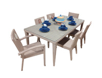 Panama Jack Austin 7-Piece Rectangular Outdoor Dining Set with anodized aluminum frames, Rehau fiber weaving, tempered glass table, and cushioned chairs