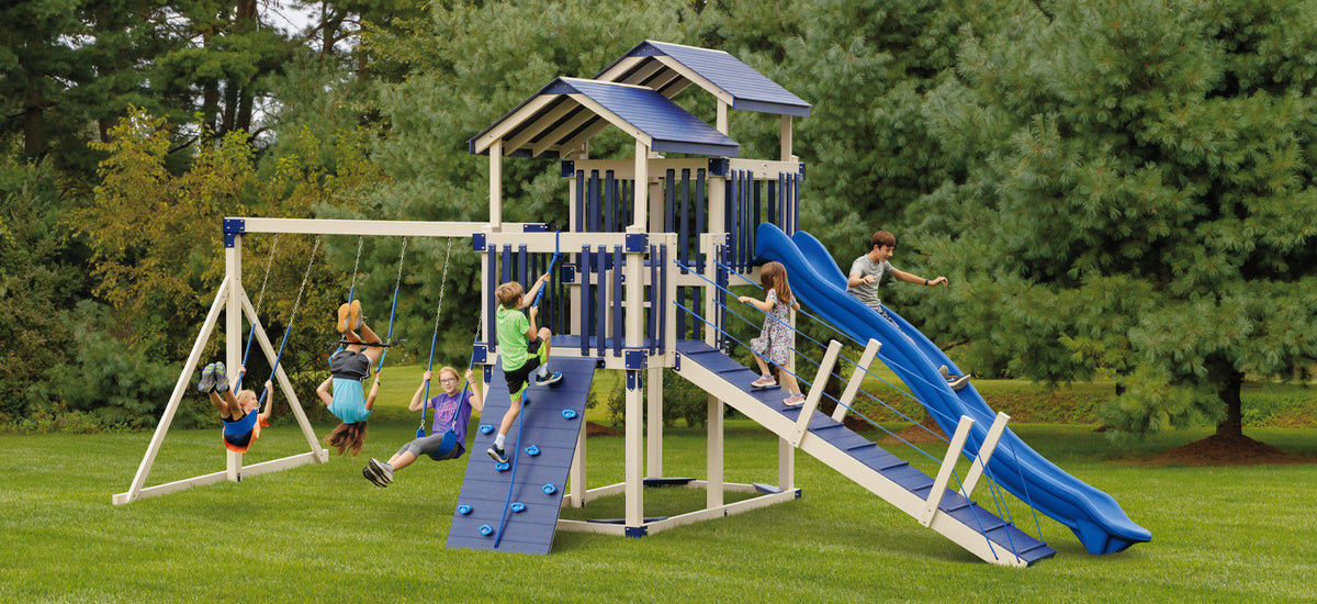 Discovery Depot Package D510-6 swing set with dual towers, ripple rush slide, rope bridge, and swings