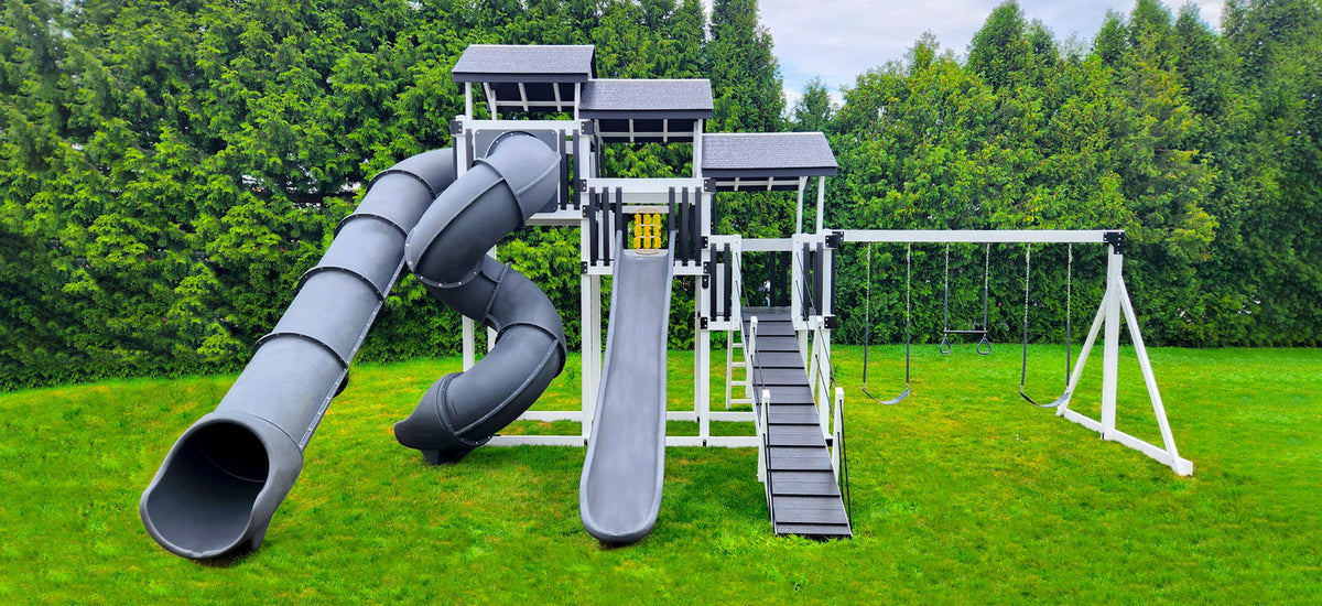 Adventure World Fantasy Fortress Package F514-8 full view - multi-level vinyl swing set with three slides and swing beam