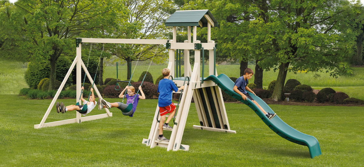 Frolic Zone Swing Set Package FA33-7 - Full playset view with Wonder Wave Slide, belt swings, and trapeze