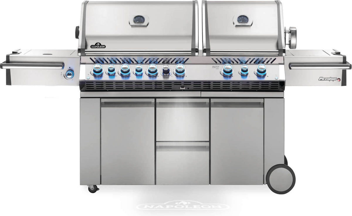 Napoleon Prestige PRO 825 RSBI propane gas grill with knobs lit in stainless steel - front hero view