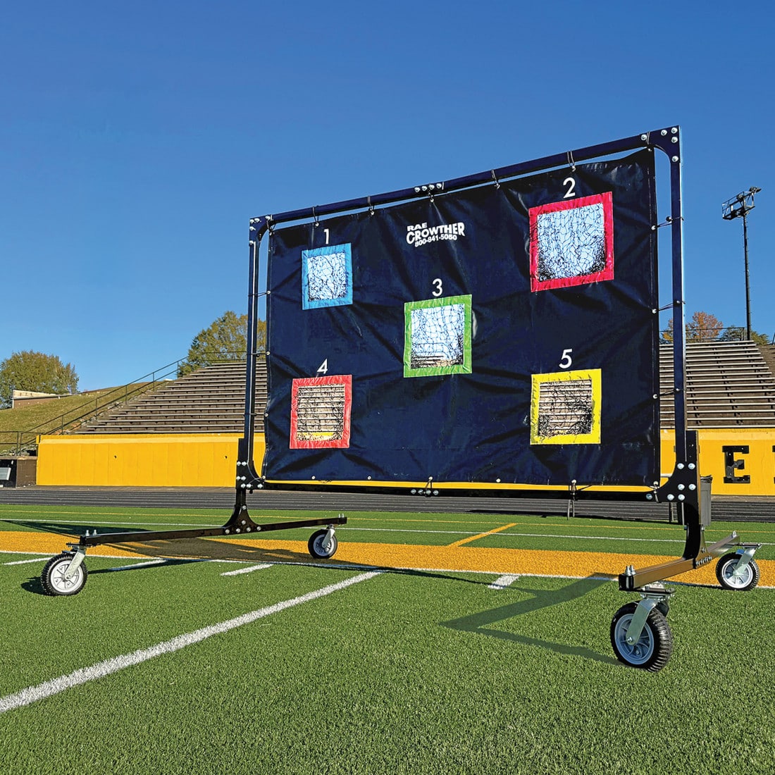Rae Crowther Pro QB Net with locking caster wheels - full view on practice field