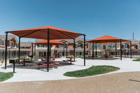 Superior Shade Hexagon Hip Shade installed at Sonoma Apartments CA with outdoor seating area