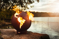 Third Rock Steel Fire Pit with darkened iron oxide patina finish