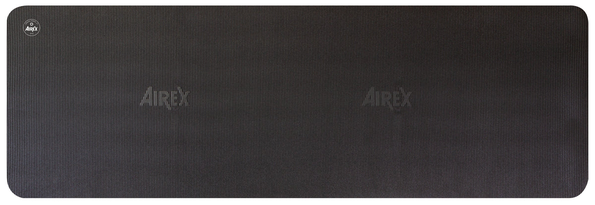 Airex Xtrema exercise mat front view - black high-density foam, 70 x 23 inches