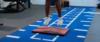 Kinvent K-Deltas force plates in action - athlete performing countermovement jump test