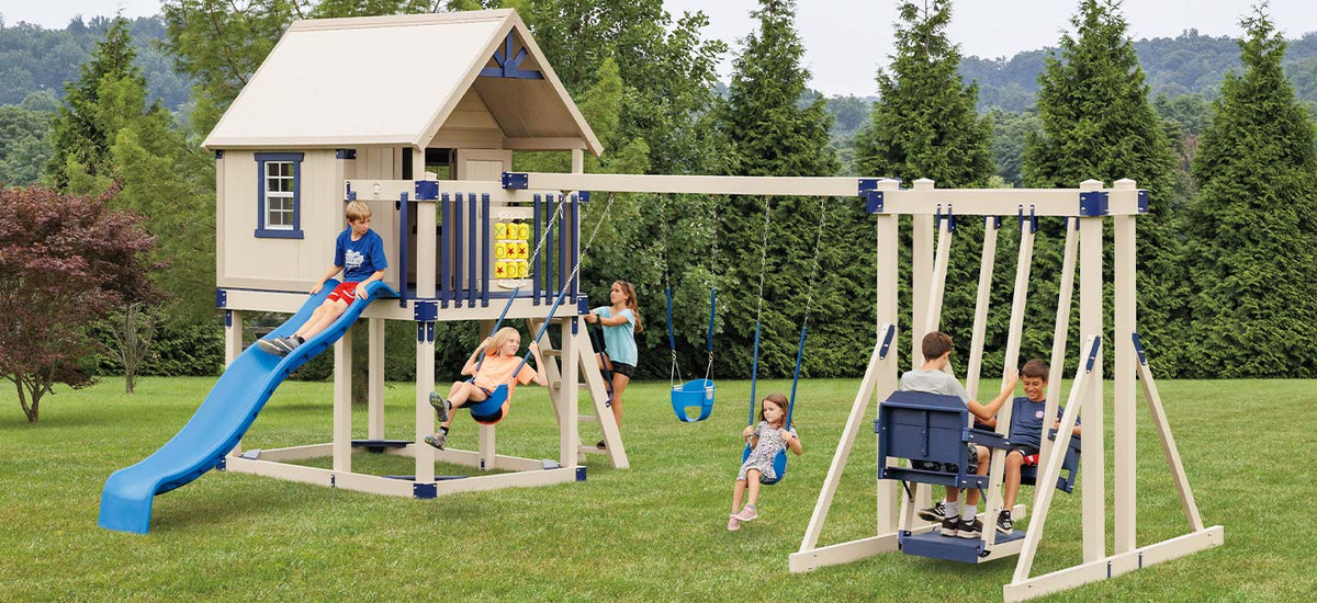 Happy Hideout Swing Set Package H68-9 with playhouse, Wonderwave slide, belt swings, bucket baby swing, and Easy Rider glider