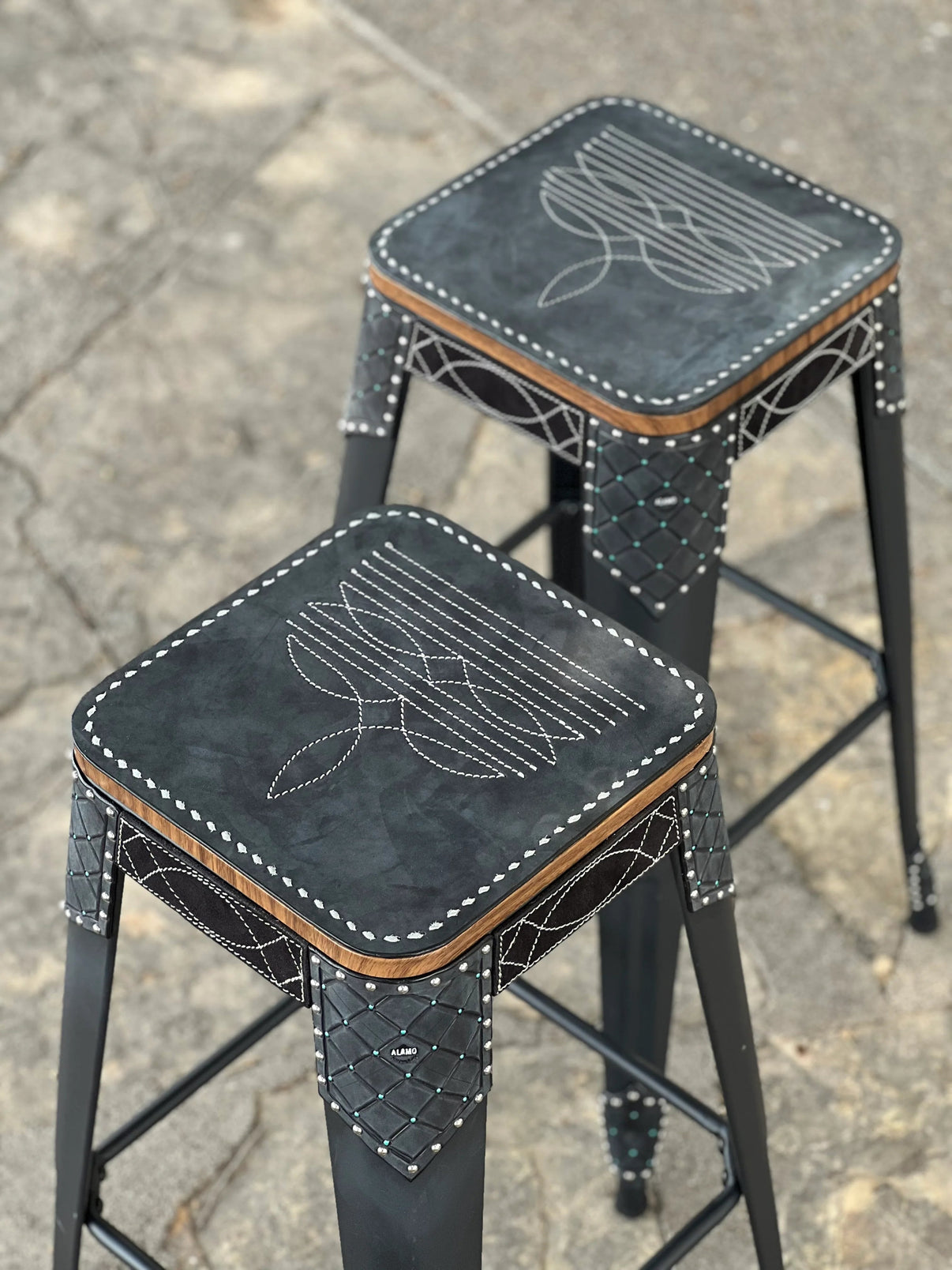 Alamo Saddlery Cowboy Stitch Bar Stools in black leather with Western buckstitch border detail