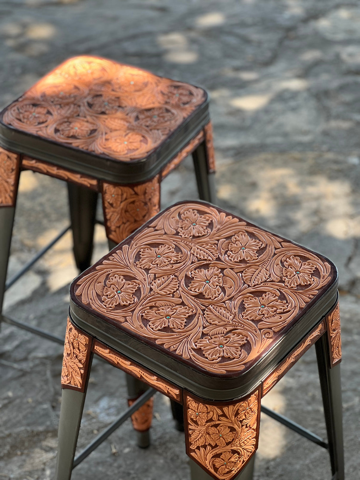 Alamo Saddlery Desert Turquoise hand-tooled leather bar stools with no back in Gun Metal finish