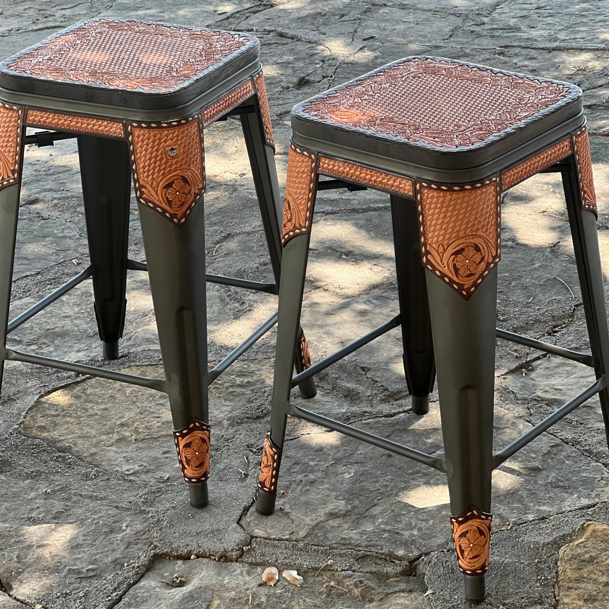 Alamo Saddlery Cinnamon hand tooled leather bar stools with gun metal frame