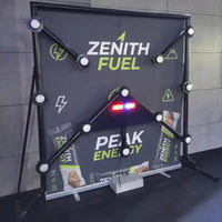 Strike-a-Light Batak speed reaction game with branded banner at trade show event
