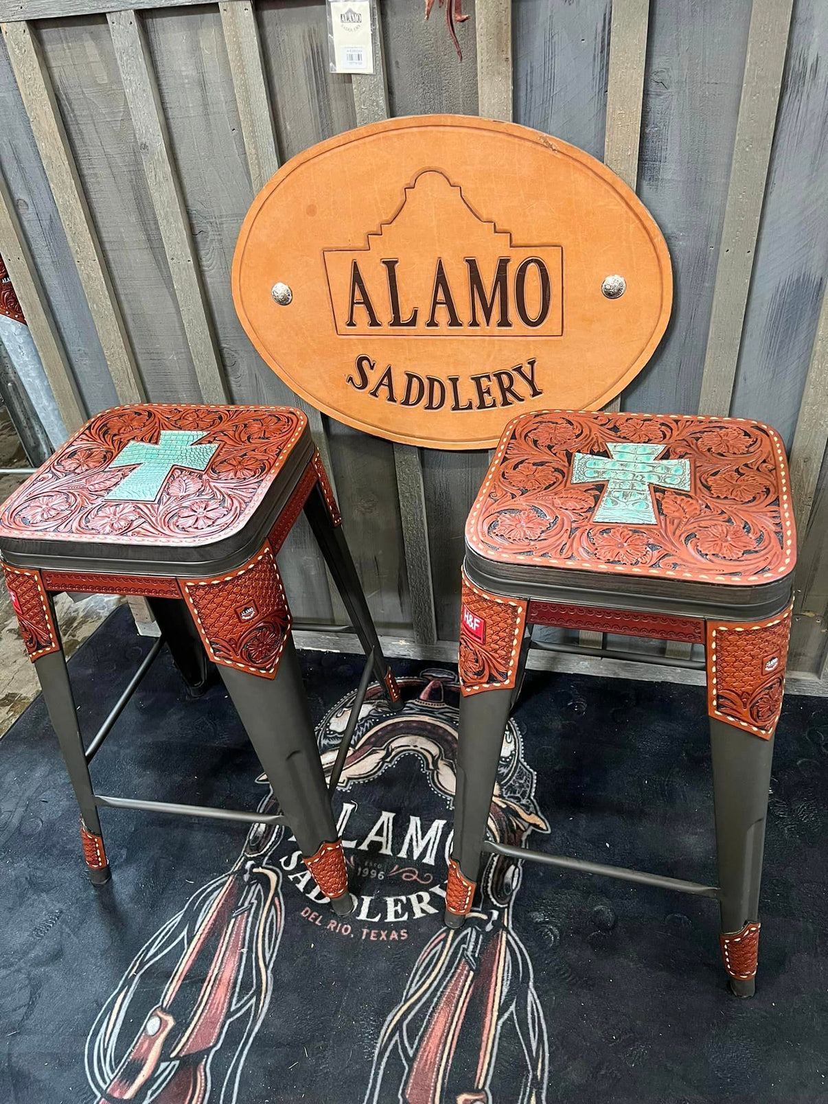 Alamo Saddlery bar stools with turquoise gator cross inlay and full floral hand-tooled toast leather